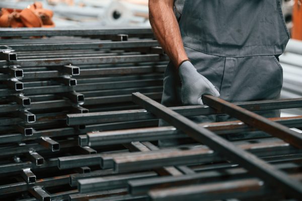 Close up view of man that is working at the factory.